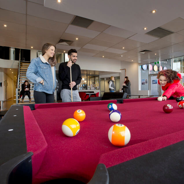 Students playing pool