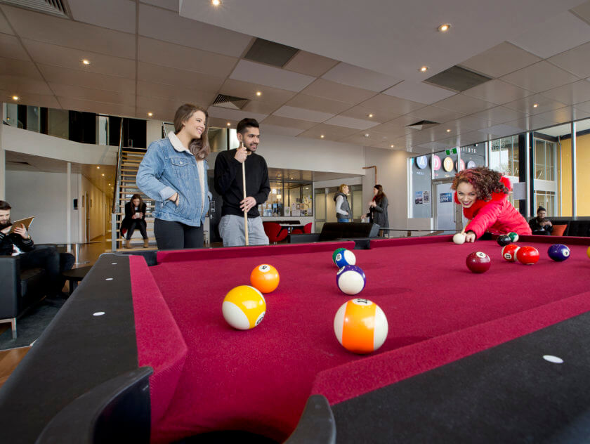 Students playing pool